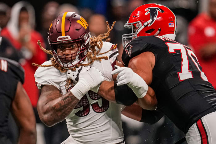 Washington Commanders defensive end Chase Young (99) battles with Atlanta Falcons offensive tackle Jake Matthews.